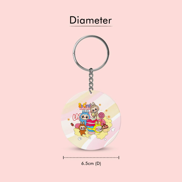 Two identical circular, double-sided keychains displayed side-by-side. The left keychain shows the front design with Labubu characters and sweets, while the right keychain shows the back design with t