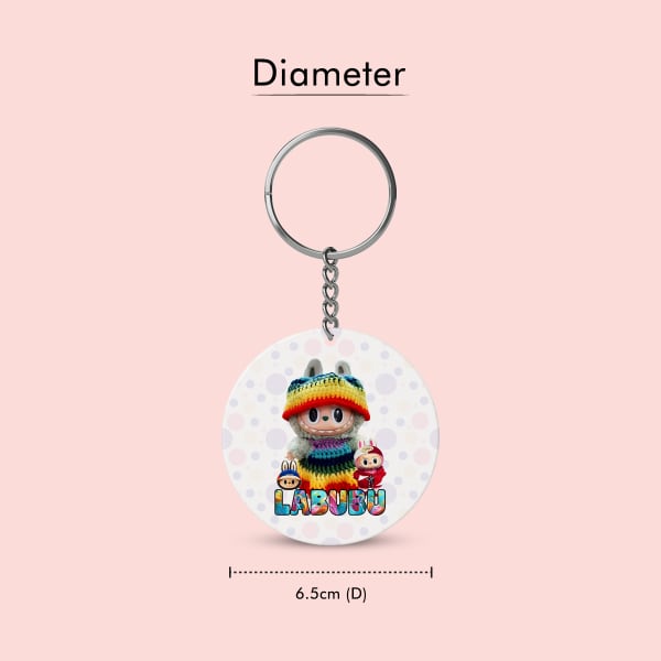 Two circular plastic keychains shown side-by-side, representing the front and back of the product. The front features a Labubu character with a knitted hat, and the back shows a different Labubu chara