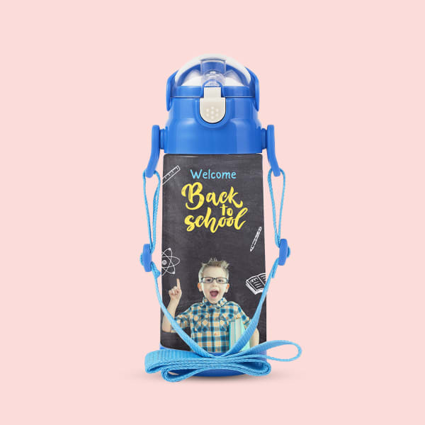 A stainless-steel water bottle for kids with a chalkboard-style design that says 