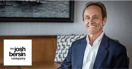 josh bersin company, smiling man business professional in a suit with modern interior design background