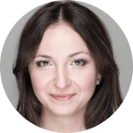 smiling woman with long dark hair and light makeup, circular headshot with soft lighting and neutral background