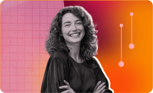 smiling woman with curly hair in black attire against colorful abstract background, cheerful expression with vibrant design elements