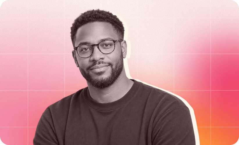 man in glasses, gradient background with soft pink and orange hues