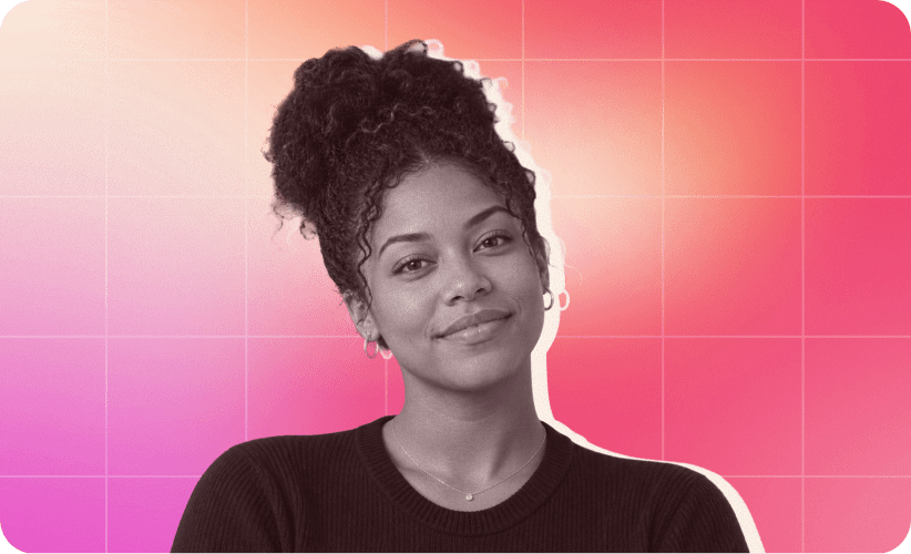 smiling woman with curly hair in black sweater against vibrant pink background, confident expression with soft lighting effects
