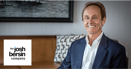 josh bersin company, smiling man business professional in a suit with modern interior design background