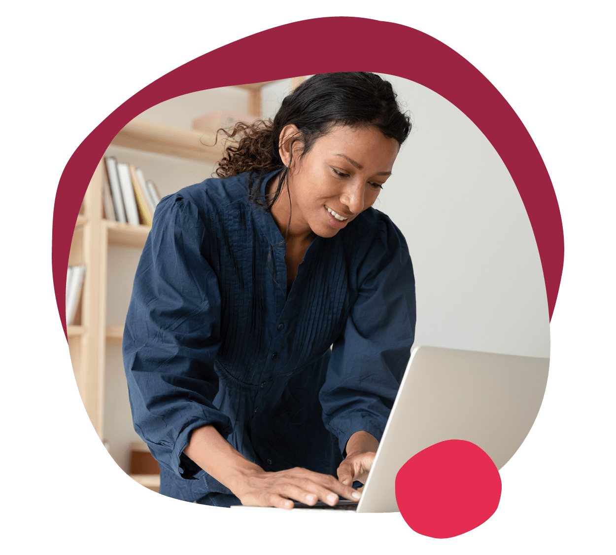focused woman working on laptop in a minimalistic workspace with bookshelves in the background, remote work productivity