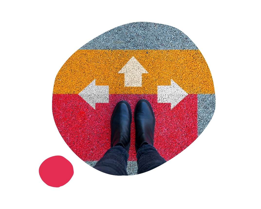footwear on colorful pavement with directional arrows indicating multiple route options, vibrant ground markings for guidance