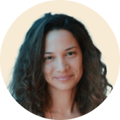 curly-haired woman smiling, light background portrait of a woman with natural beauty