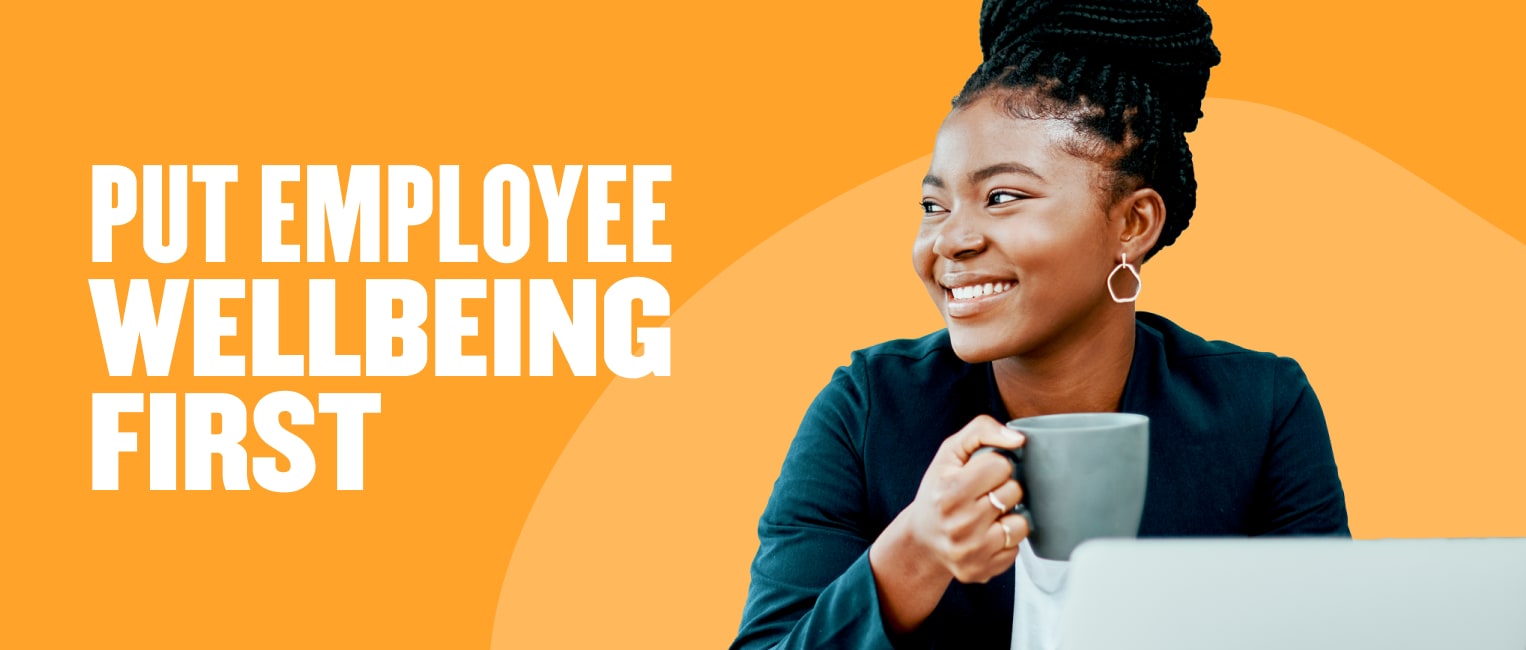 employee wellbeing, smiling professional woman holding a coffee cup in a modern workspace with bright orange background