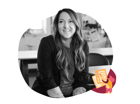 professional woman smiling in a classroom setting, engaging educator with creative visuals and materials