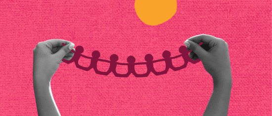 hands holding cut-out paper figures against a vibrant pink textured background with a sun graphic, creative representation of unity and connection