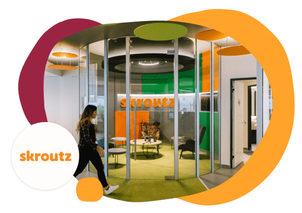 skroutz-office-reception-modern-design-colorful-elements, woman-entering-glass-enclosed-space-comfortable-seating