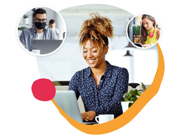 smiling woman using laptop in a vibrant workspace with coffee, focused on digital collaboration, remote work environment with diverse individuals