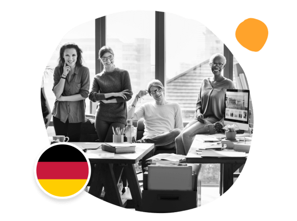 team workspace, German flag in creative office with diverse professionals smiling and collaborating