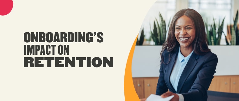 onboarding impact on employee retention, smiling professional in business attire holding documents in an office setting