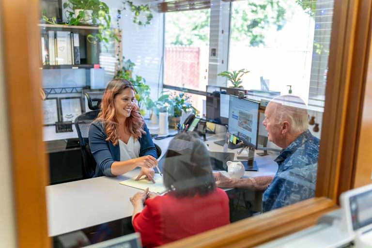 Accountant helping clients in her office