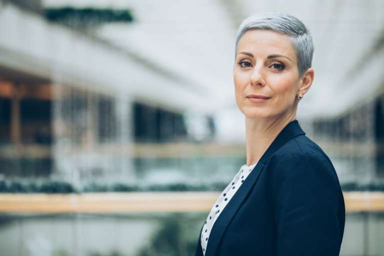 Senior businesswoman in office