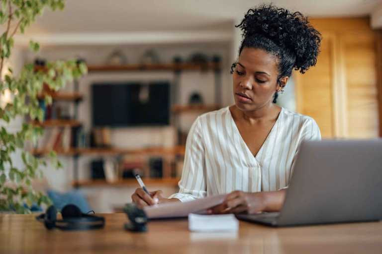 Doctoral psychology student working at a desk.