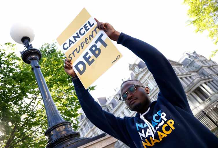 Wisdom Cole of the NAACP joins student debtors to once again call on President Biden to cancel student debt at an early morning action outside the White House