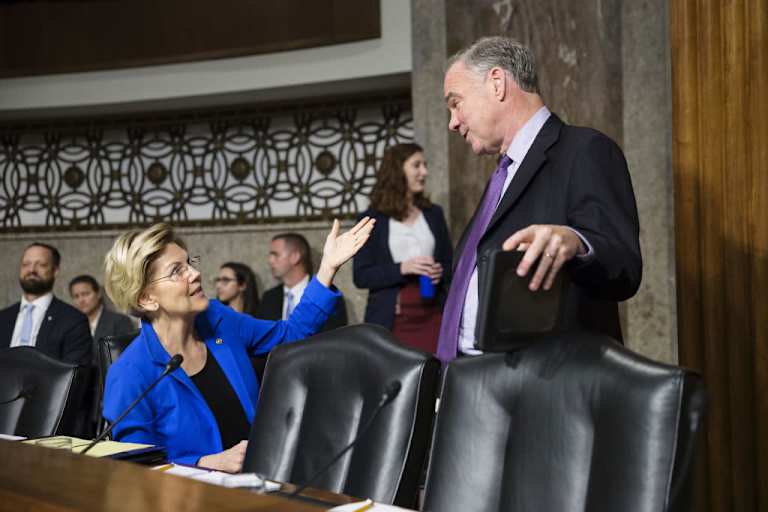 Senator Elizabeth Warren, a Democrat from Massachusetts, left, speaks with Senator Tim Kaine, a Democrat from Virginia, while arriving for a Senate Armed Services Committee confirmation hearing for Mark Esper, secretary of defense nominee for U.S. President Donald Trump, not pictured, on Capitol Hill in Washington, D.C., U.S., on Tuesday, July 16, 2019. Esper's confirmation as secretary of defense is a matter of urgency after almost seven months with an acting leader at the Pentagon, the top Republican and Democrat on the Senate Armed Services Committee said at the hearing. Photographer: Sarah Silbiger/Bloomberg via Getty Images