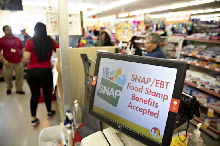 "SNAP/EBT Food Stamp Benefits Accepted" is displayed on a screen inside a Family Dollar Stores Inc. store in Chicago, Illinois, U.S., on Tuesday, March 3, 2020. Dollar Tree Inc. released earnings figures on March 4. Photographer: Daniel Acker/Bloomberg via Getty Images