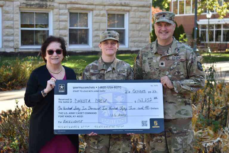 Dakota Drew, a ROTC student and sophomore at North Central College in Naperville, Illinois, is presented with a check as an award for excellence from the U.S. Army.
