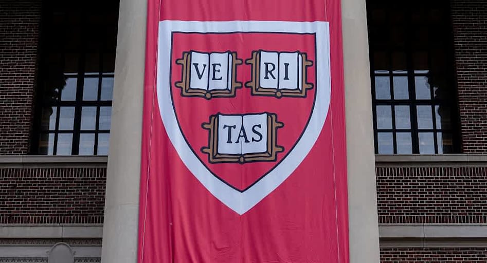Harvard University's Veritas shield on a banner