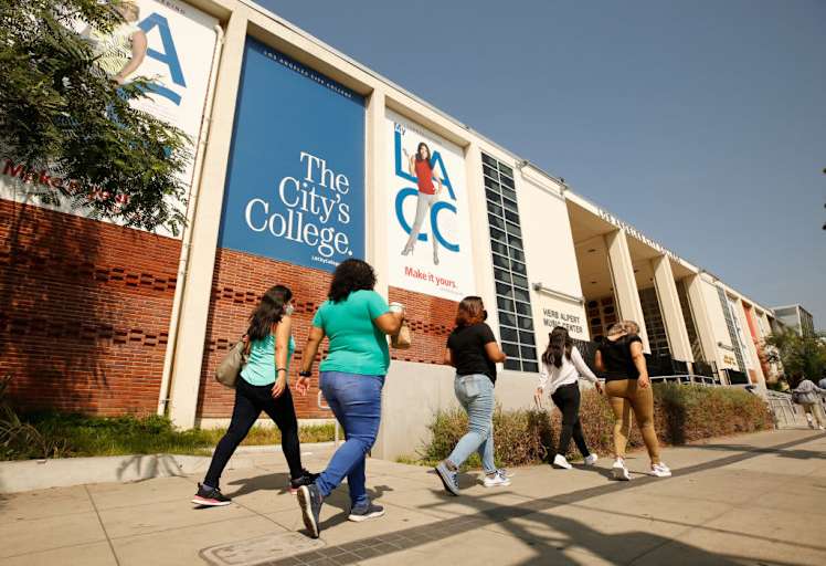 Adult students walk to class on the Los Angeles Community College campus as a portion of the enrolled student body returns to in-class instruction.