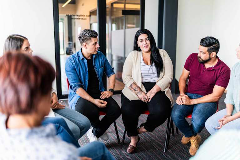 Psychology students speaking in a group