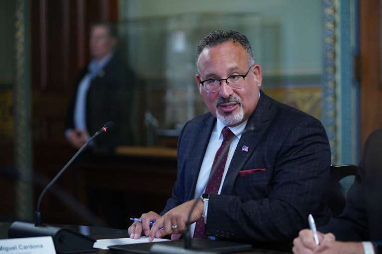 U.S. Education Secretary Miguel Cardona speaks during a roundtable discussion with US Vice President Kamala Harris and college presidents in the Eisenhower Executive Office Building in Washington, DC.