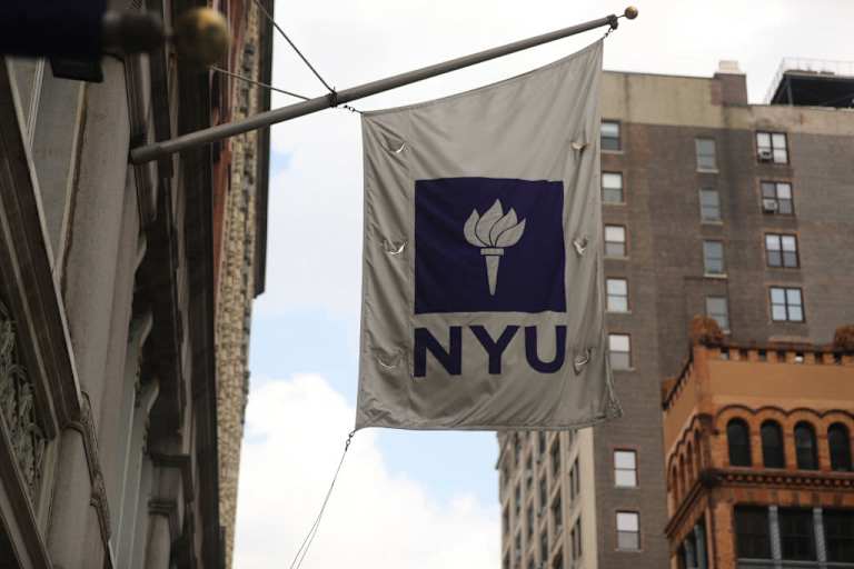 NYU flag hanging outside building