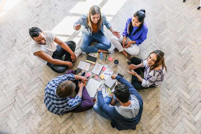 Students studying together in a circle