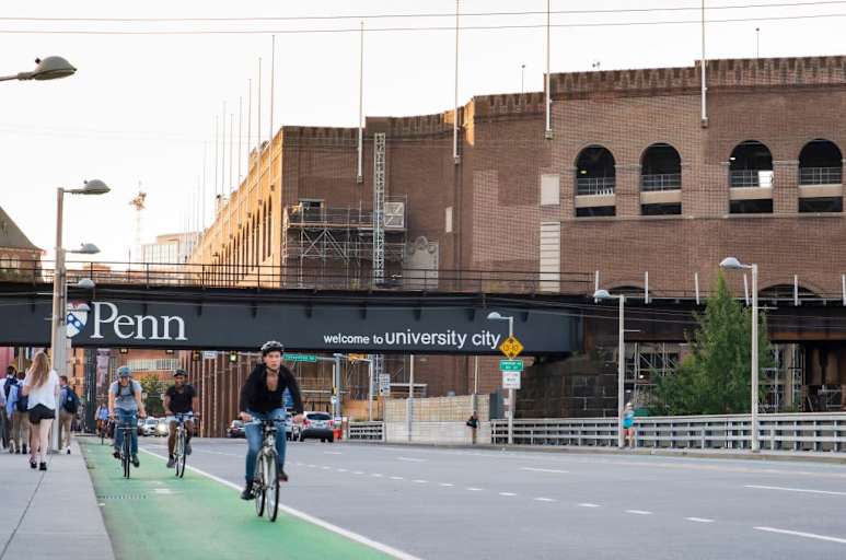 Cyclists commuting on city streets bike lanes with cars and traffic, University City, Philadelphia, Pennsylvania, USA. (Photo by: Jumping Rocks/UCG/Universal Images Group via Getty Images)