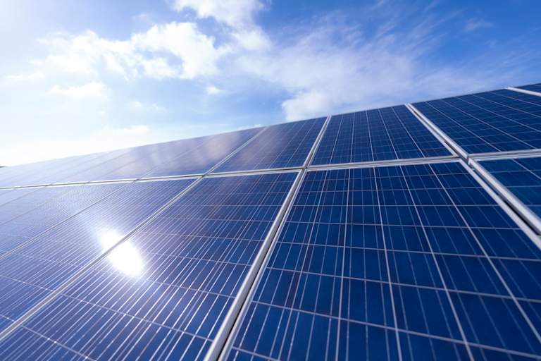 detailed view of solar panel under the sunny blue sky