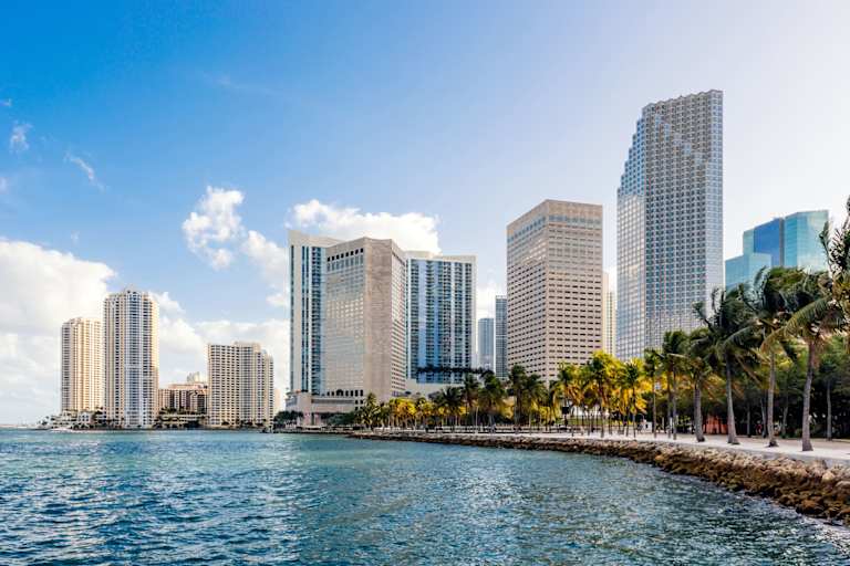 Boardwalk along the waterfront in downtown Miami, Florida, on a sunny summer day.