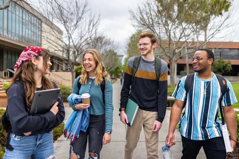 Diverse College Students Walking on Campus