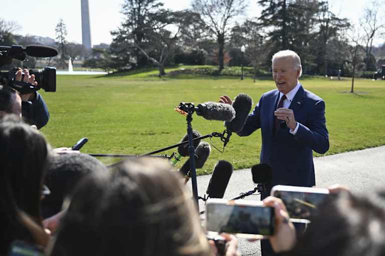 US President Joe Biden speaks to press as he departs for California to attend campaign reception across the state on February 20, 2024, in Washington, DC.