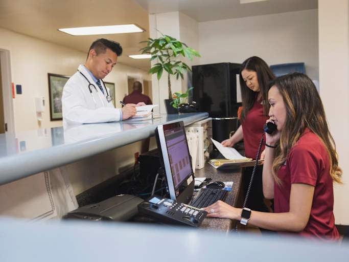 Busy nurse, medical assistant and doctor in hospital