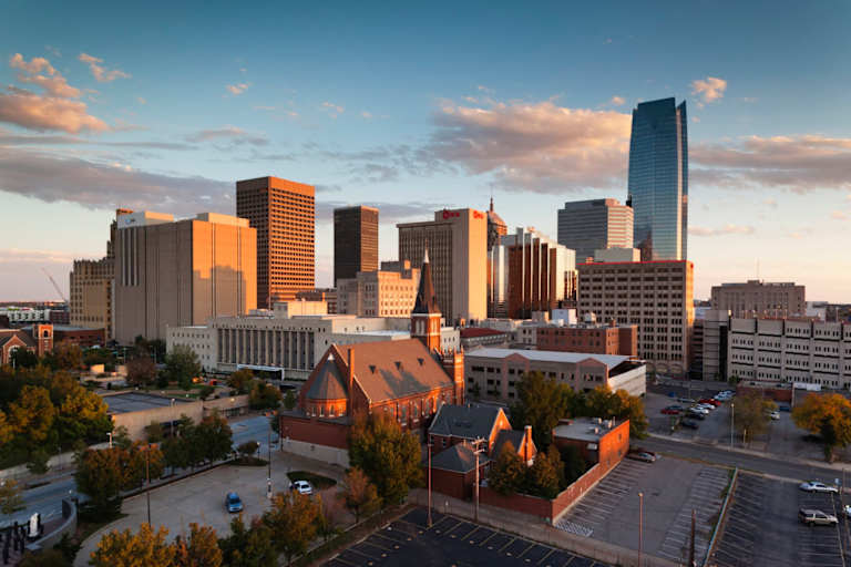 Downtown Oklahoma City skyline over Devon Tower, at sunset.