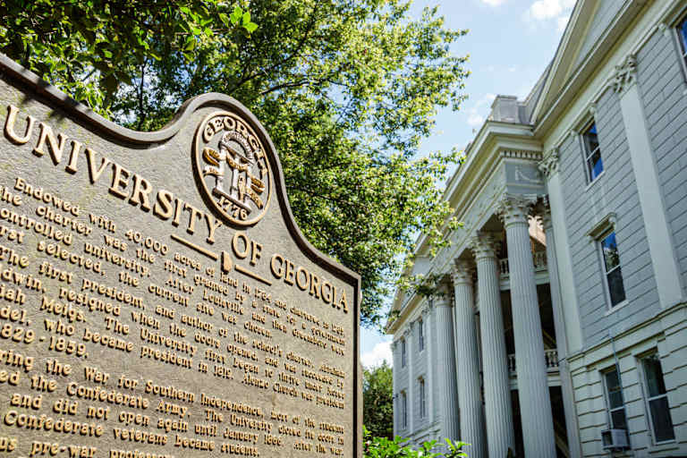 A historic marker sign on the University of Georgia campus, North Campus Quad, in downtown Athens, Georgia.