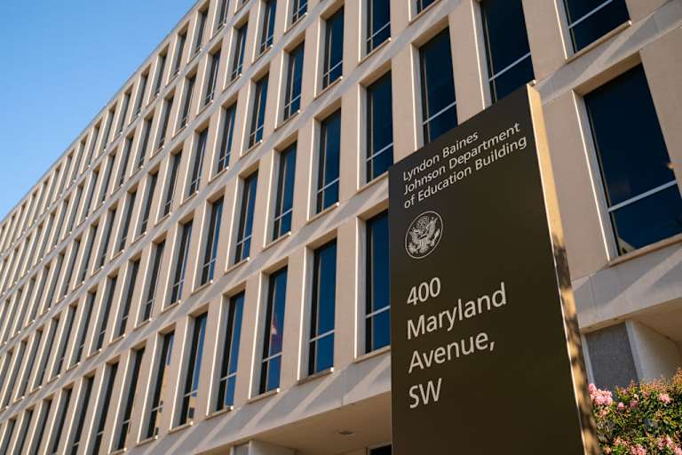 The exterior of the U.S. Department of Education building in Washington, DC, on a clear sunny day.