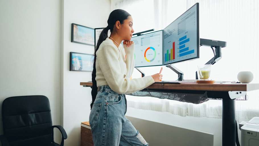 Woman working from home with her standing desk.