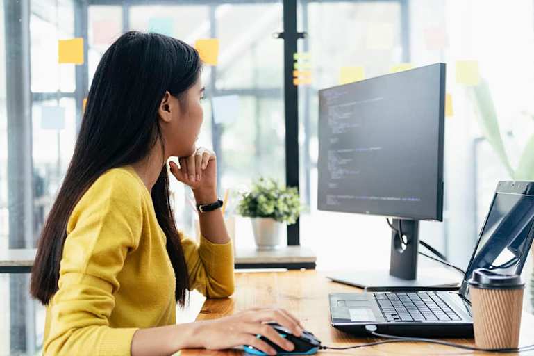 Woman using computer mouse