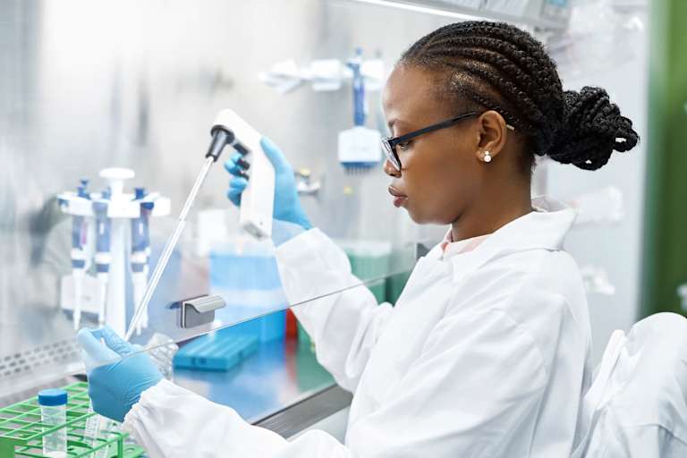Scientist analyzing medical sample in laboratory