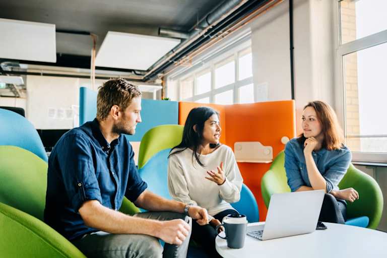 Three people having a meeting