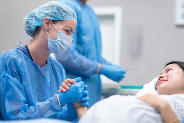 Labor and delivery nurse supporting patient