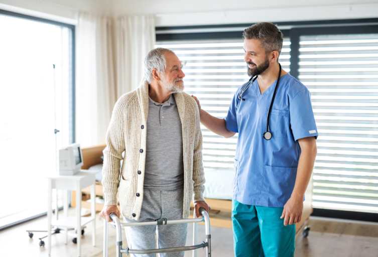 Nurse comforting older patient