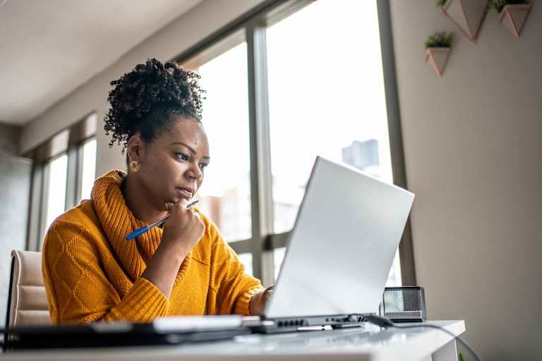 Woman taking test on laptop