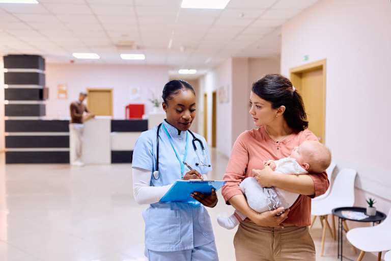 Nursing student helping new mother