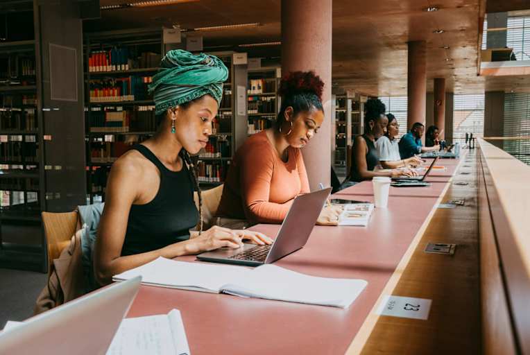 Women studying together in a library